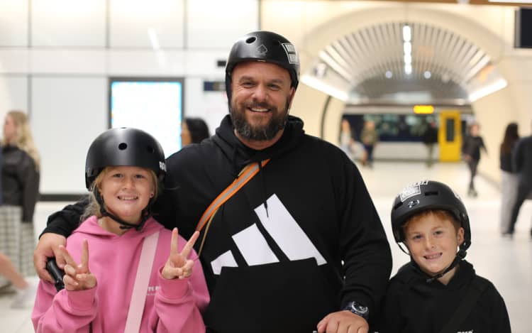 Bryce Ongley with his two kids (Frankie left) at Karangahape station on the opening day of the CRL